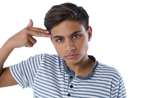 Portrait of teenage boy making gun gesture with his hand