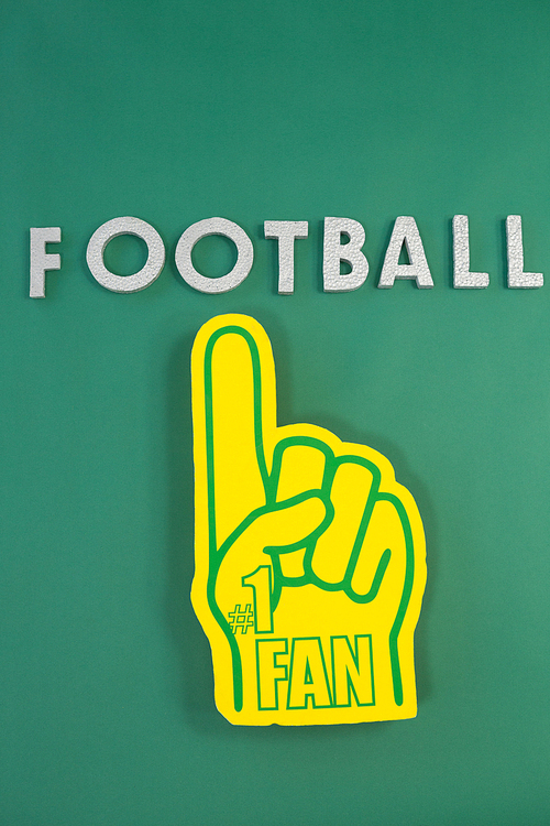 Close-up of foam hand on green background