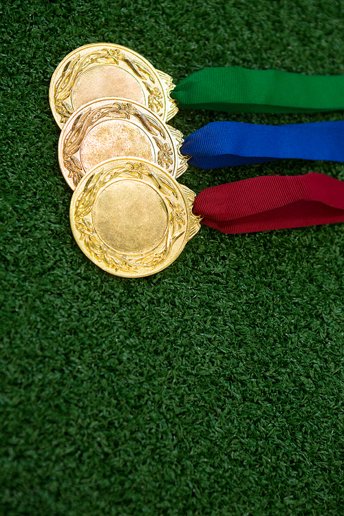 Close-up of medals on artificial grass