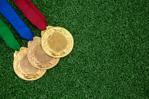 Close-up of medals on artificial grass