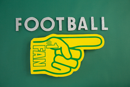 Close-up of foam hand on green background