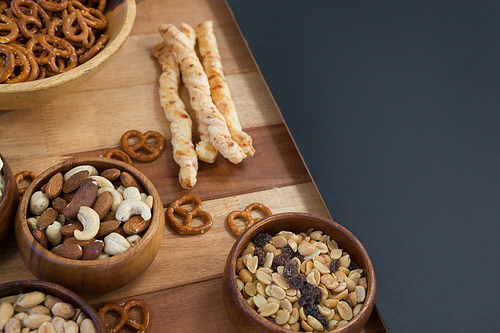 Close-up of various snacks on wooden table