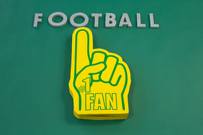 Close-up of foam hand on green background