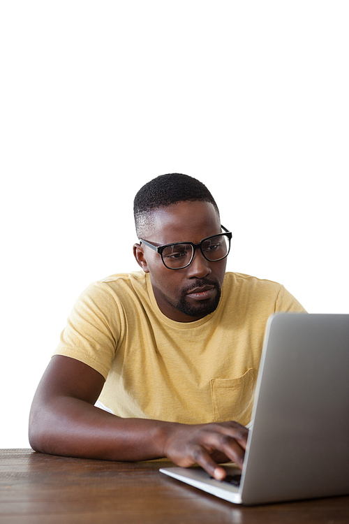 Man in spectacle using laptop against white background