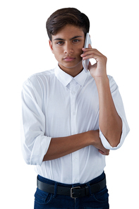 Boy talking on mobilephone against white background