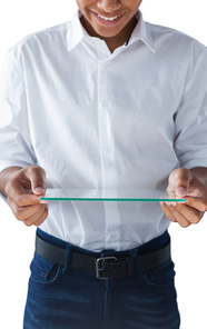 Mid section of teenage boy holding a glass digital tablet