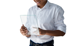 Mid section of teenage boy using a glass digital tablet