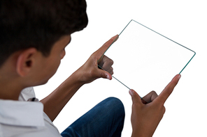 Close-up of teenage boy using a glass digital tablet