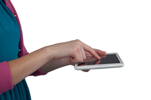 Mid section of girl using digital tablet against white background