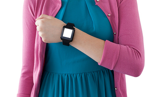 Mid section of teenage girl showing her smartwatch