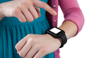 Close-up of teenage girl using smartwatch