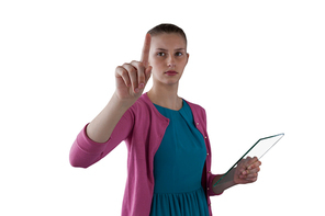 Teenage girl pressing an invisible virtual screen against white background