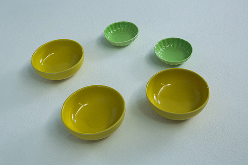 Overhead of empty bowls on white background