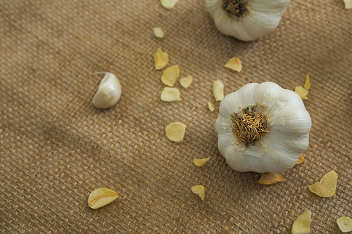 Close-up of garlics on textile