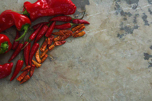 Overhead of red chilies, dried red chili pepper and capsicum