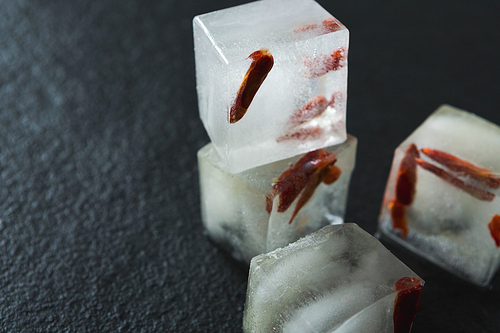 Close-up of flavored ice cubes with spices