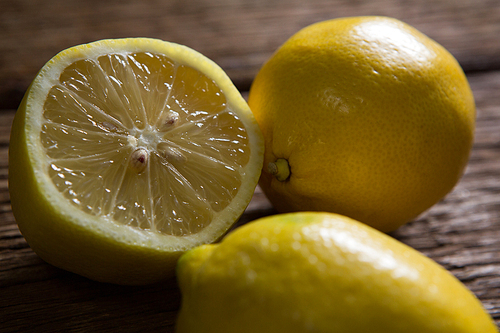Close-up of fresh lemon on wooden table