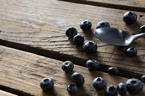 Close-up of blueberries on wooden table