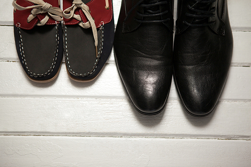 Overhead view of shoes on wooden floor