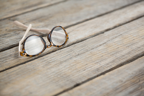 Close up of eyeglasses on wooden table