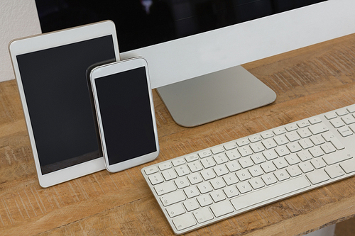 Various electronic gadgets on table in office