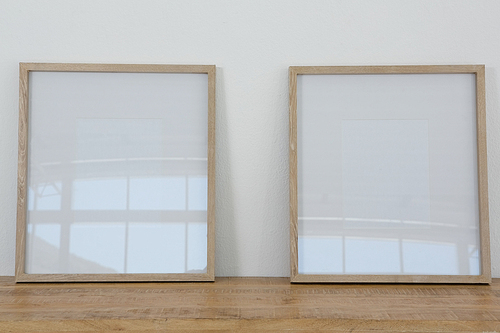 Close-up of frames arranged on wooden table