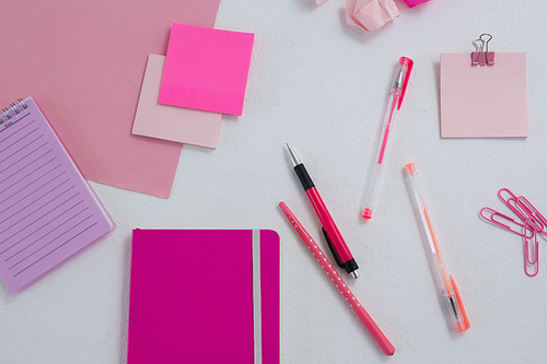 Overhead of various office accessories on white background