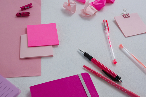 Overhead of various office accessories on white background