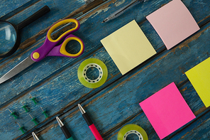 Overhead of office accessories on wooden plank