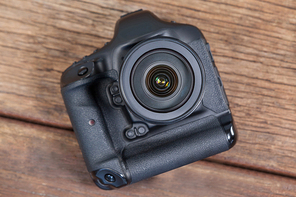 Close-up of digital camera on table in studio