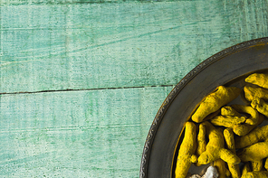 Close-up of turmeric sticks in plate