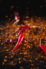 Close-up of red chilli flakes against black background