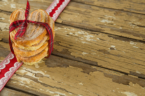 Close-up of sweet food tied on lace