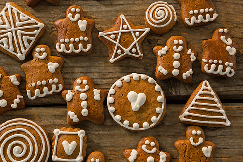 Overhead view of various ginger bread cookies on wooden table