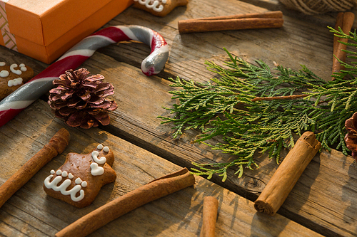High angle view of Christmas decoration with spice on wooden table
