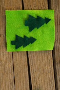 Directly above shot of Christmas green decoration on wooden table