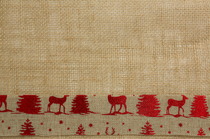 Close up of jute ribbon with animal representation on burlap