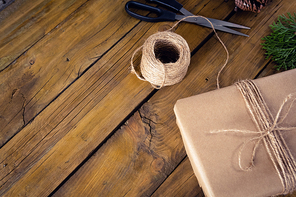 Close-up of fir and wrapping materials on wooden table