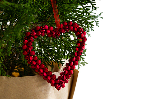 Close-up of heart shape christmas decoration hanging on christmas tree