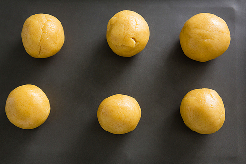 Close-up of dough balls on cooking tray