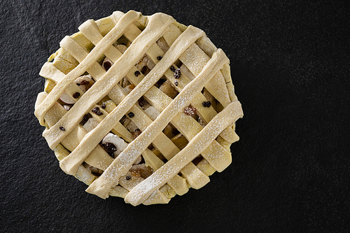 Close-up of raw tart on concrete background