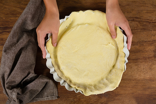 Close-up of woman preparing fruit tart