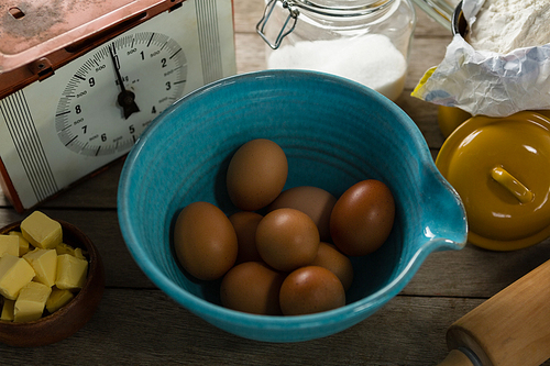 Overhead view of various ingredients on a wooden table