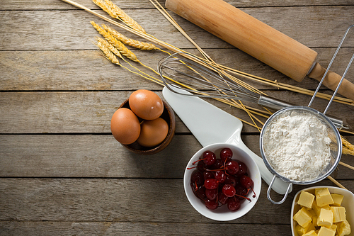 Overhead view of various ingredients on a wooden table