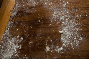 Over head view of left over flour after flattening dough on a wooden table