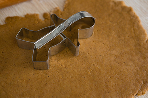 Close-up of cookie cutter placed over flattened dough