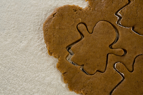 Close-up of flattened dough cut with a cookie cutter