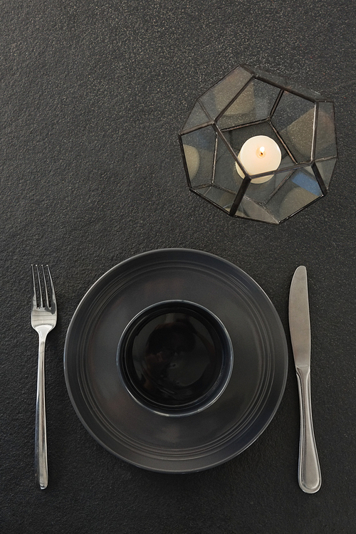 Close-up of black theme table setting