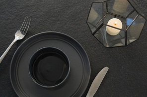 Close-up of black theme table setting