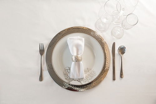 Overhead of elegance table setting on white background